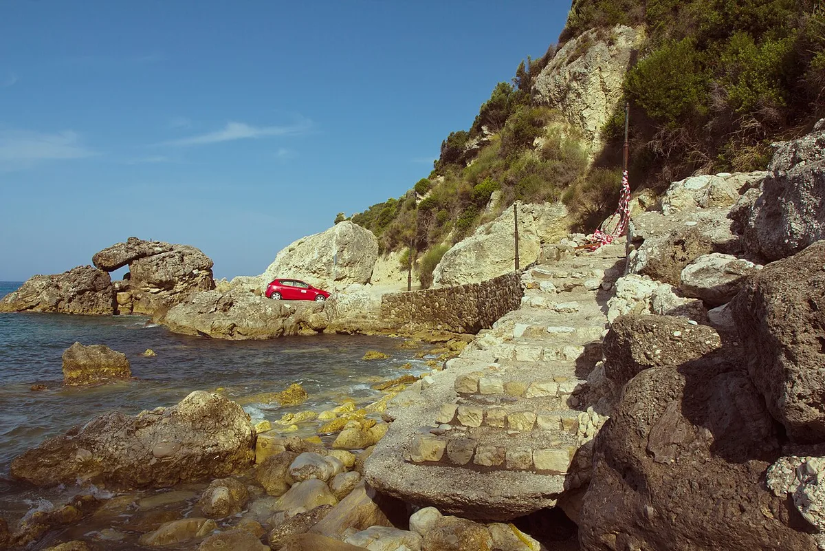Greece map islands: lush coast of Corfu bordering the Ionian Sea
